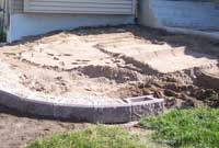 installing first course of retaining wall blocks