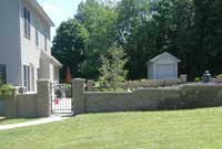 Courtyard two sided wall system with gate provides privacy Courtyard two sided wall system with gate provides privacy