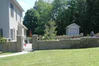 Courtyard two sided wall system with gate provides privacy