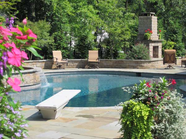 Backyard with pool with patterned retaining wall Backyard with pool with patterned retaining wall