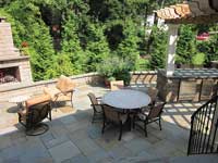 Patio with seat wall and fireplace