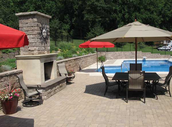 Wall and fireplace around pool Wall and fireplace around pool