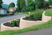 Three walls to create a terraced application with shrubs and plants