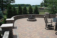 Outdoor patio with patio wall and fire pit