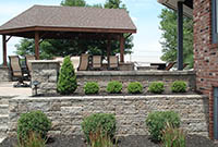 Raised patio with planting area Raised patio with planting area
