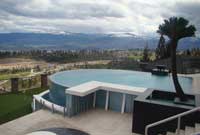 Above ground swimming pool with retaining wall Above ground swimming pool with retaining wall