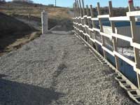 Using select backfill during wall construction Using select backfill during wall construction
