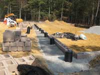 Using the Sleeve-It® System by Strata to Install a Fence above a retaining wall Using the Sleeve-It System by Strata to Install a Fence above a retaining wall